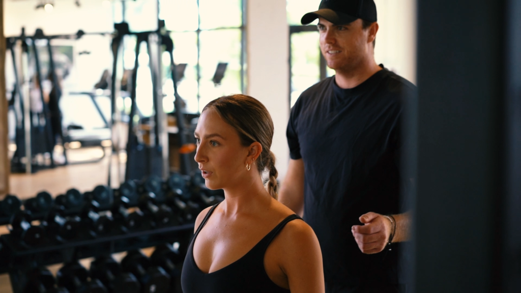 Central Fitness: Naples - Trainer coaching woman at the gym